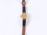 an image of a close up of a wrist watch on a white surface