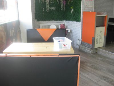 a room that has a table and chairs in it