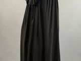 a black cape with ruffles on a mannequin mannequin mannequin mannequin mannequin mannequin mannequin manne