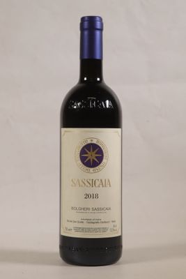 a bottle of wine that is sitting on a table