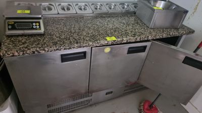 a kitchen with a stove, oven, sink and other appliances