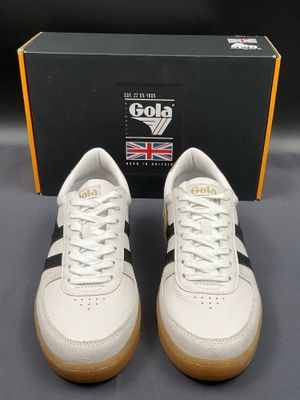 a close up of a pair of white and black sneakers