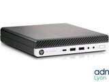 the hp desktop computer is sitting on a white surface