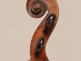 an old violin with a very long neck and a long bow