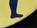 a yellow surfboard with a blue and white design on it
