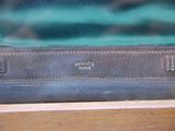 a piece of luggage sitting on top of a wooden table