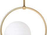 une grande suspension en forme de silhouette humaine en laiton, avec une boule de verre blanc suspendue au plafond