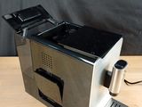 an image of a coffee machine on a wooden table