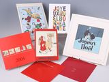 five greeting cards in a box on a table
