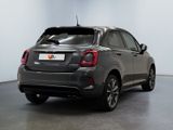 the back end of a grey fiat suv parked in a room