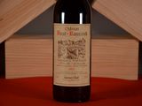 a bottle of wine that is sitting on a table