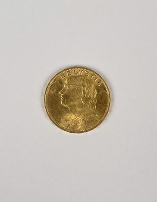 une pièce d'or sur une surface blanche avec un fond blanc