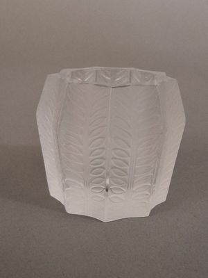 a glass vase that is sitting on a table
