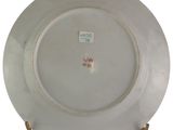 a white plate with a red and green design on it