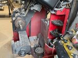 an image of a machine that is working on a piece of metal