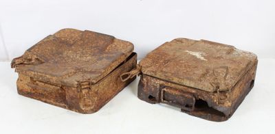 two old suitcases sitting next to each other on a white surface