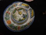 a plate with a spoon and a plate with a bowl on it