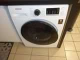an image of a washing machine in a kitchen