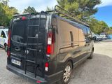 a black van that is parked in a parking lot