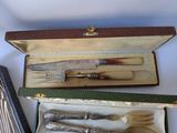 a box with a knife, fork and spoons inside of it