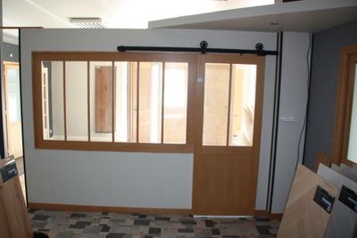 a room that has a window and a door in it