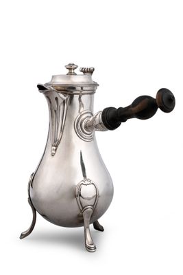 an image of a silver coffee pot sitting on top of a table