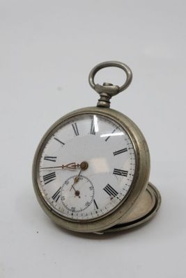 a silver pocket watch with roman numerals on it