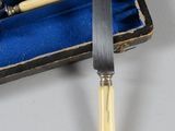 five knives in a box with a knife on it