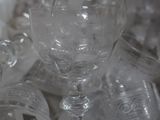 a lot of empty wine glasses sitting on a table