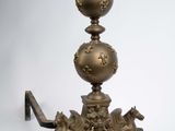 an image of a large brass vase on a stand with a horse on it