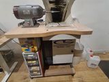 a machine that is sitting on top of a wooden table