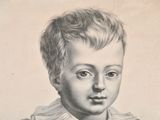 portrait of a young boy wearing a collared shirt and a bow tie