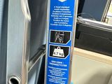 a close up of a metal door handle on a bus