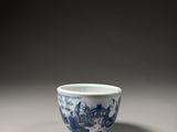 a blue and white bowl with a dragon design on it