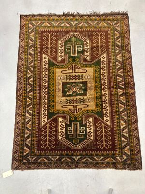 a close up of a rug on display on a white surface
