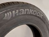 a close up of a tire on a white surface