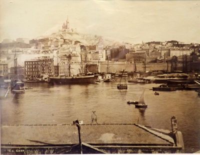 an old photo of a harbor with boats in it