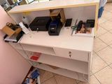 a white desk with a printer on top of it