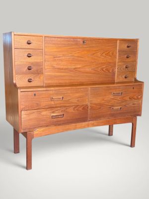 an image of a wooden dresser with drawers and drawers