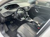 the interior of a small car with a steering wheel and dashboard