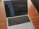 a laptop that is sitting on a wooden table