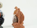 two figurines that are sitting next to each other