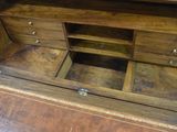 a wooden desk with drawers and drawers on top of it