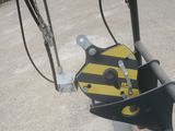 a close up of a yellow and black sign on a pole