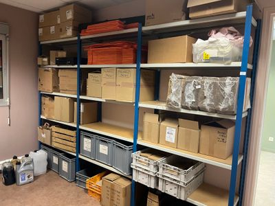 many boxes and boxes on the shelves in the room