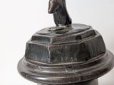 a statue of a bear on top of a pedestal