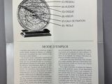 an image of a brochure with a drawing of a clock on it