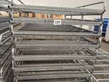 several rows of metal shelves in a warehouse with a price tag on them