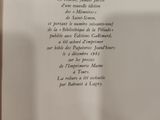 an open book with a picture of a clock on it