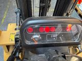 a close up of a forklift with a gauge on it